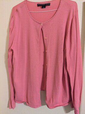 Coral colored sweater.